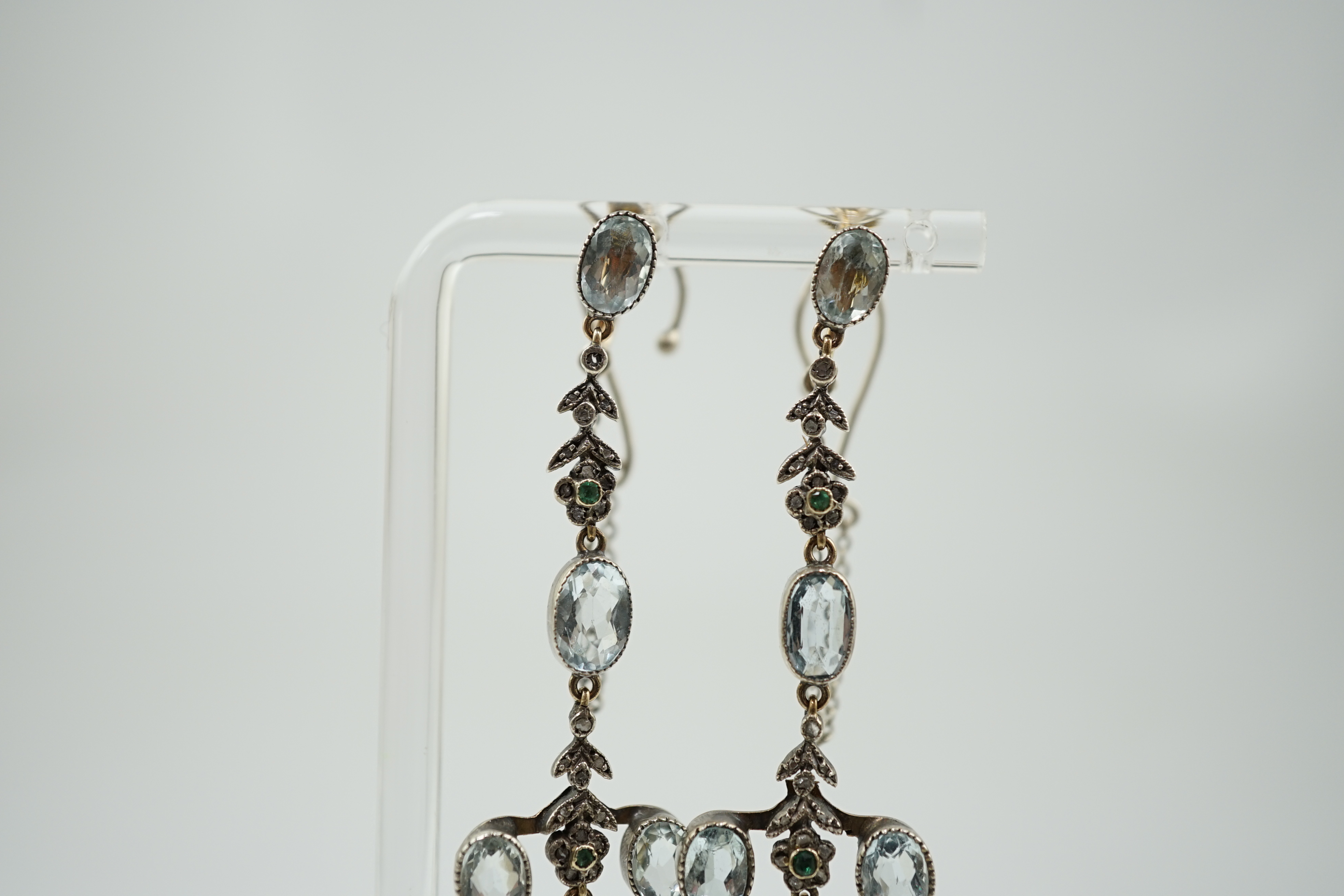 A pair of Belle Epoque gold and silver, aquamarine, rose cut diamond and emerald cluster set drop ear clips